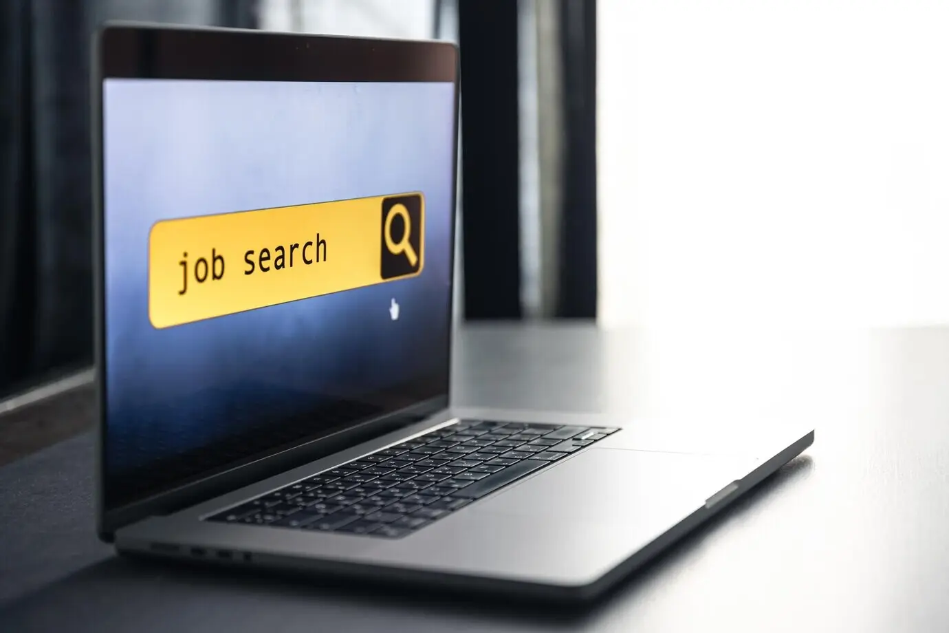 Laptop screen displaying a job search page on a computer application website